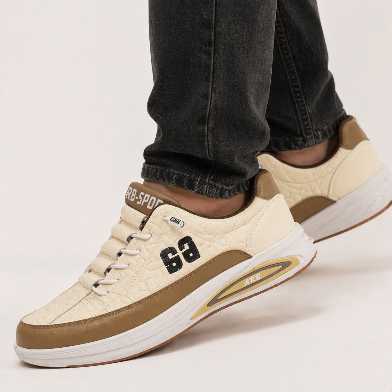 Model wearing ZK Apex Cream Sole Racer sneakers